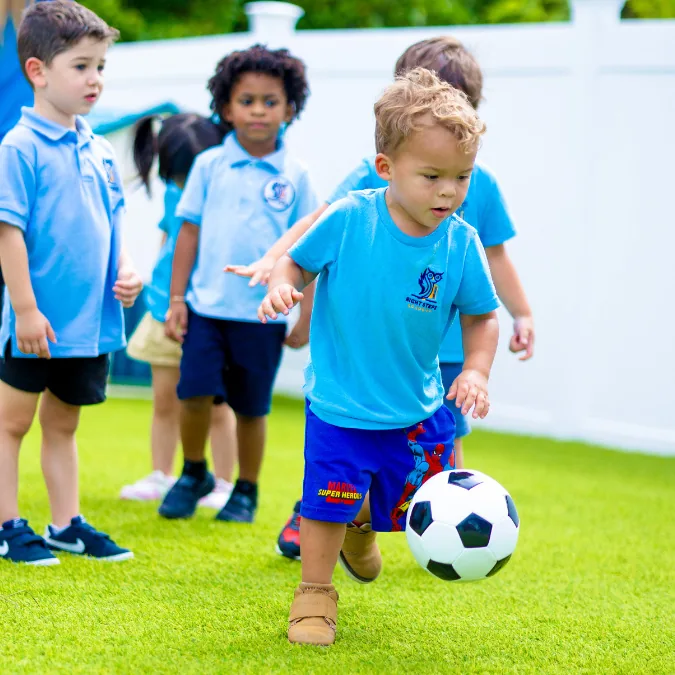 Children playing with a soccer ball outdoors